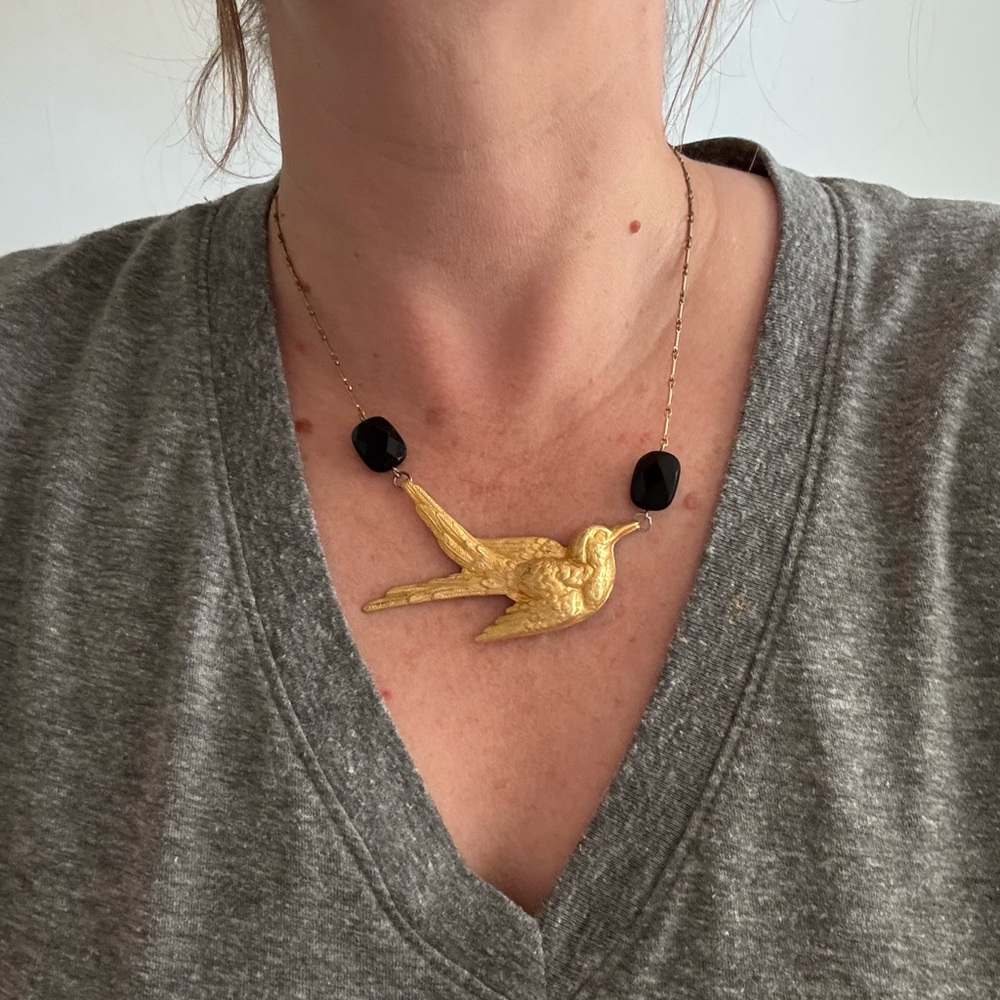 Elegant Gold Bird Necklace with Black Accents